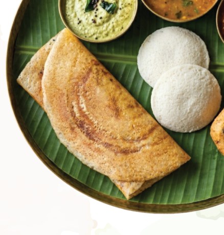 Freshly made dosa and idly served on banana leaf at Sri Arunachalam
